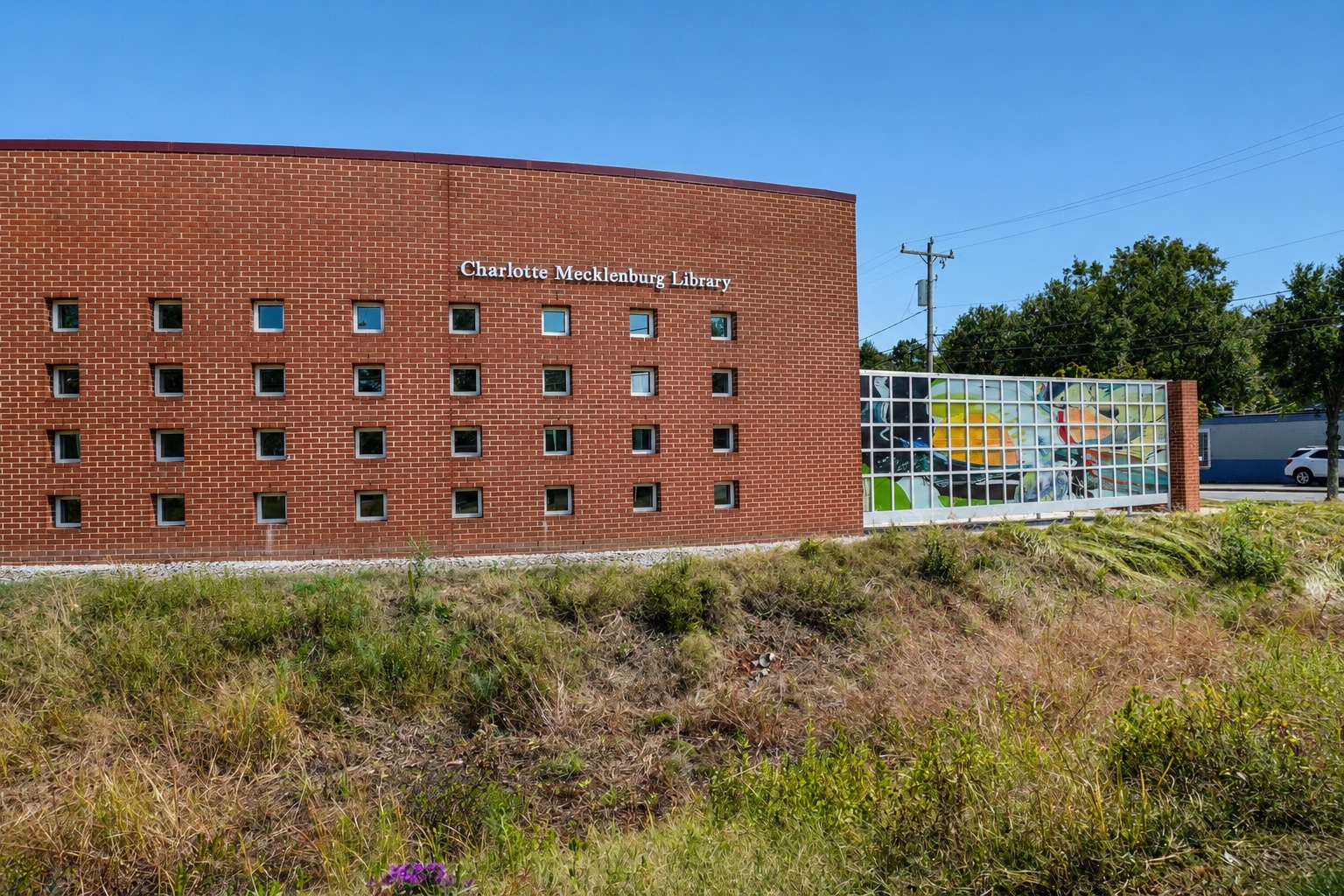 Allegra Westbrooks Regional Library exterior with established native-style landscape planting.